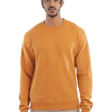 Man wearing a Champion Adult Powerblend Crewneck Sweatshirt in Gold Glint.