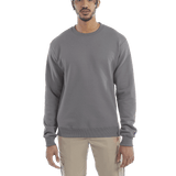 Man wearing a Champion Adult Powerblend Crewneck Sweatshirt in Stone Gray.