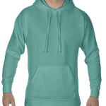 Front view of a man wearing a Comfort Colors Heavyweight Hoodie in Seafoam, showing the hoodie’s drawstring hood and front pocket. The model is smiling.