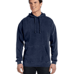 Model in a Comfort Colors Heavyweight Hoodie, True Navy, showcasing a casual look with a front pocket and drawstring hood. The hoodie offers a comfortable fit
