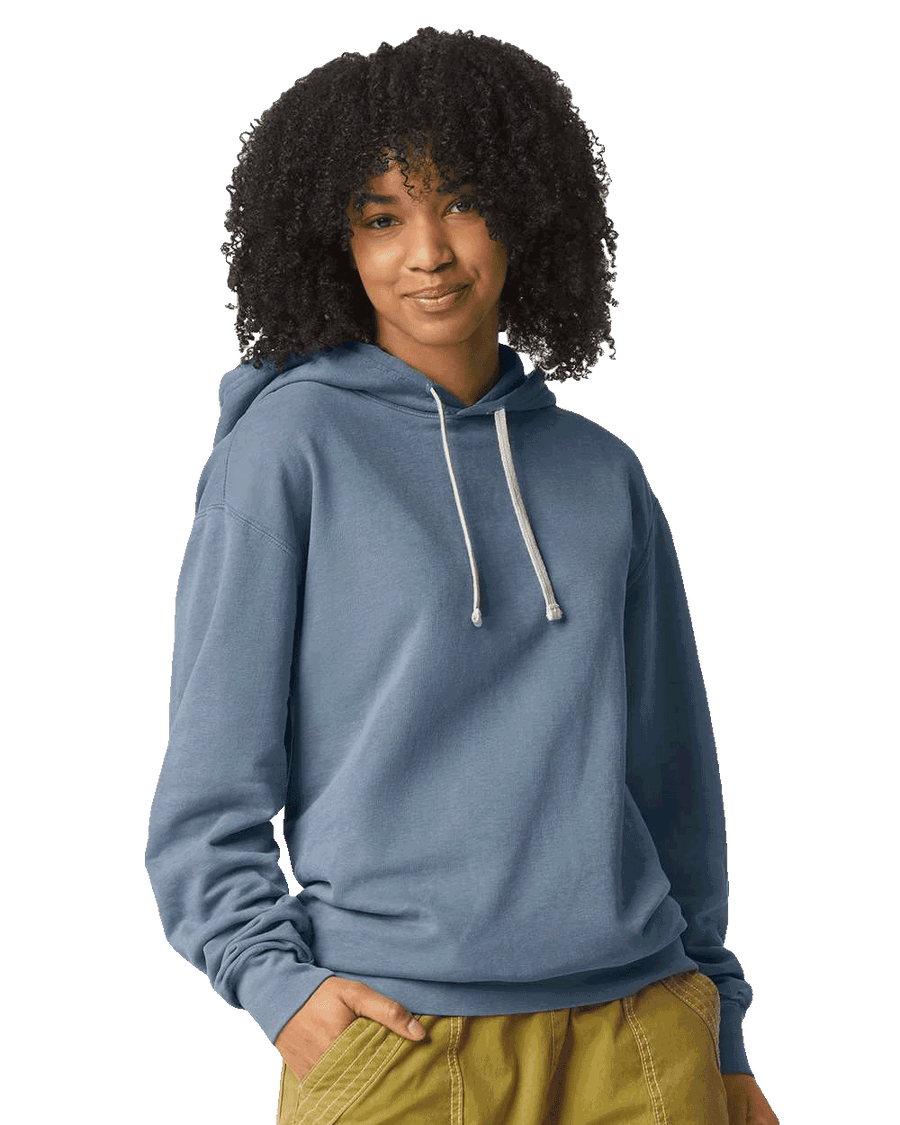 A model wearing a Comfort Colors - Garment-Dyed Lightweight Fleece Hooded Sweatshirt