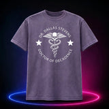 Grape Comfort Colors 1717 T-shirt featuring the Dr. Dallas Stevens winged skull emblem, front view
