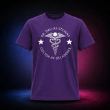 Purple Gildan Softstyle 64000 T-shirt featuring the Dr. Dallas Stevens winged skull emblem, front view