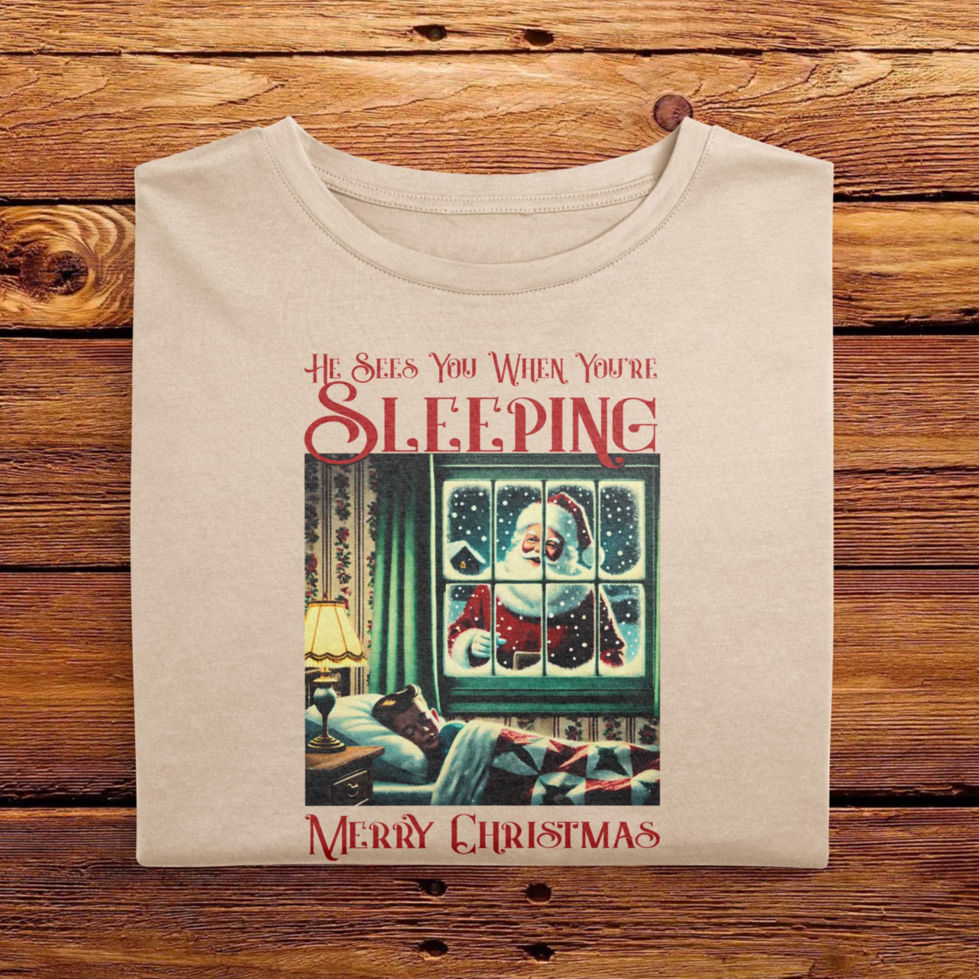 A Folded Ivory White Comfort Colors Tshirt featuring a vintage festive halftone design. The funny, yet creepy design has words that says He Sees You When Youre Sleeping, accompanied with a picture of Santa Clause standing outside of a kids bedroom window.