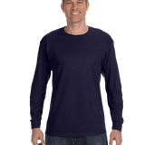 Man wearing a Gildan Heavy Cotton Long Sleeve T-shirt in Navy.