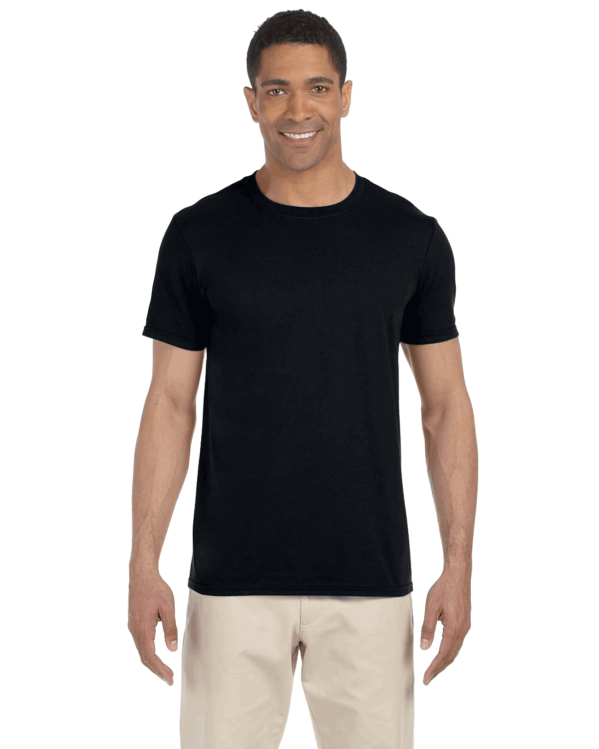 Man wearing a Gildan SoftStyle T-shirt in "Black" color, standing with a relaxed posture and smiling.