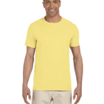 Gildan SoftStyle T-shirt in "Cornsilk" color worn by a man, standing casually with a cheerful expression.