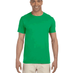 Man wearing a Gildan SoftStyle T-shirt in "Irish Green" color, standing with a relaxed posture and smiling.