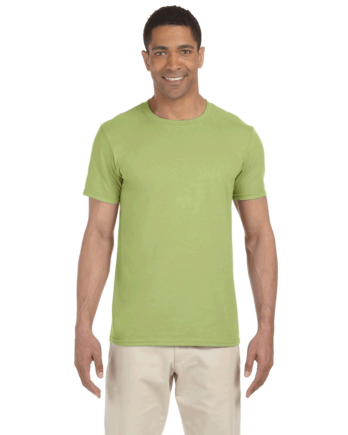 Man in a "Kiwi" colored Gildan SoftStyle T-shirt, standing with a relaxed posture and a friendly smile.