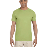 Man in a "Kiwi" colored Gildan SoftStyle T-shirt, standing with a relaxed posture and a friendly smile.