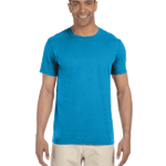 Man in a "Sapphire" colored Gildan SoftStyle T-shirt, standing with a relaxed posture and a friendly smile.