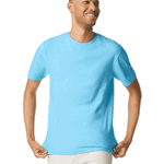 Man wearing a Gildan SoftStyle T-shirt in "Sky" color, standing with a relaxed posture and smiling while holding the hem of his shirt.