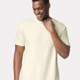 Man wearing a beige t-shirt against a white background