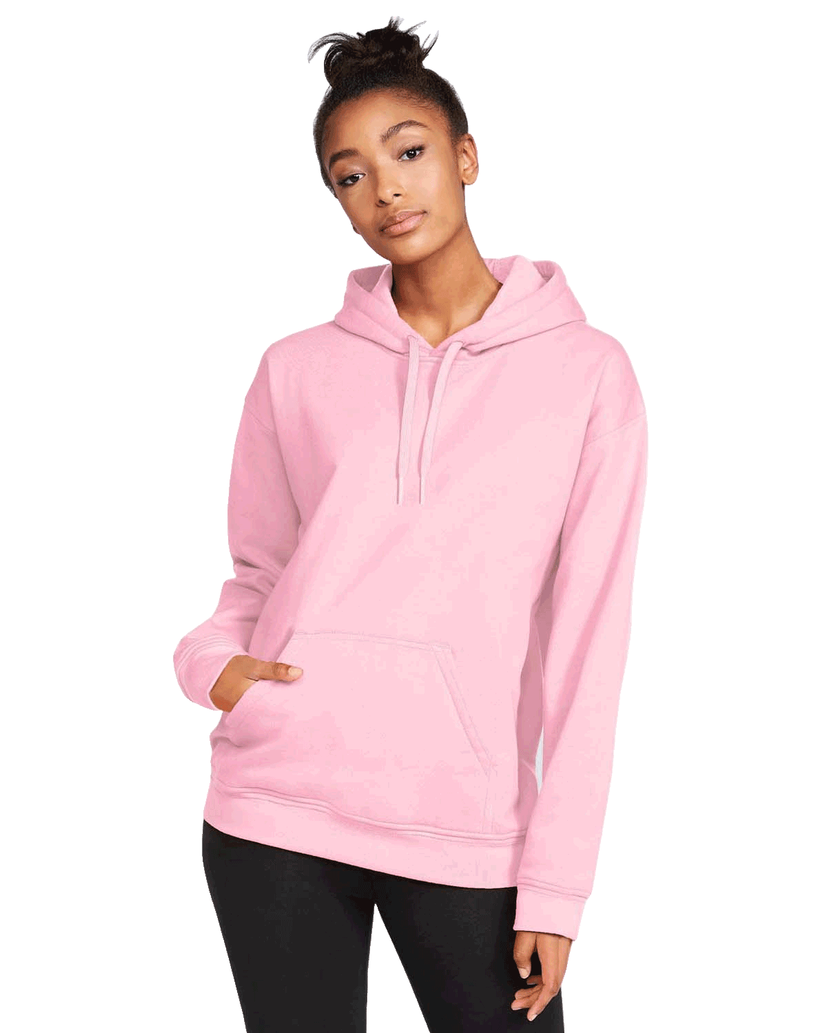 Front view of a woman wearing a Gildan Adult Softstyle Fleece Pullover Hoodie in the Light Pink color, standing with a neutral expression