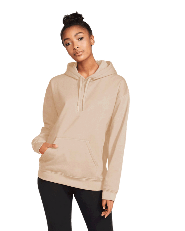A woman model, wearing a Natural color Gildan hoodie and black pants
