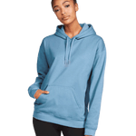 Front view of a woman wearing a Gildan Adult Softstyle Fleece Pullover Hoodie in Stone Blue color, with hands relaxed by her sides