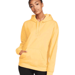 Front view of a woman wearing a Gildan Adult Softstyle Fleece Pullover Hoodie in Yellow Haze color, standing with a neutral expression