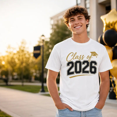 Graduate wearing a white Class of 2026 shirt at an outdoor graduation party