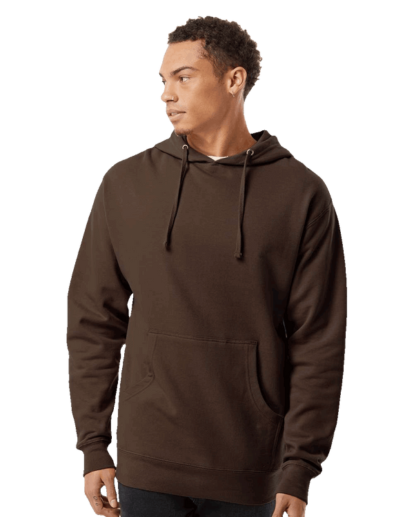 Male model wearing a plain brown hoodie – Front view with hood down and hands relaxed, styled with black pants.