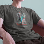 A model wearing a pepper tshirt with a festive design featuring Moo Deng, a baby pygmy hippo wearing Santa hats in three poses with a full moon behind. The text reads I want a Hippopotamus for Christmas, blending holiday fun with festive cheer.