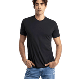 Man in a black Next Level Apparel Unisex CVC Crewneck T-Shirt, standing with hands in pockets and a relaxed posture.