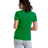 Woman showing the back of a Next Level Apparel Unisex CVC Crewneck T-Shirt in "Kelly Green" color, standing casually.