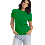 Woman wearing a Next Level Apparel Unisex CVC Crewneck T-Shirt in "Kelly Green" color, standing with hands in pockets and a slight head tilt.