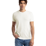 Man in a white Next Level Apparel Unisex CVC Crewneck T-Shirt, standing with hands in pockets and a relaxed posture.