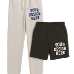 High-resolution transparent PNG mockup of cream jogger sweatpants and black athletic shorts with customizable “Your Design Here” side prints.