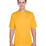 Team 365 Men's Zone Performance T-Shirt in "Sport Athletic Gold" color worn by a smiling boy, standing casually.