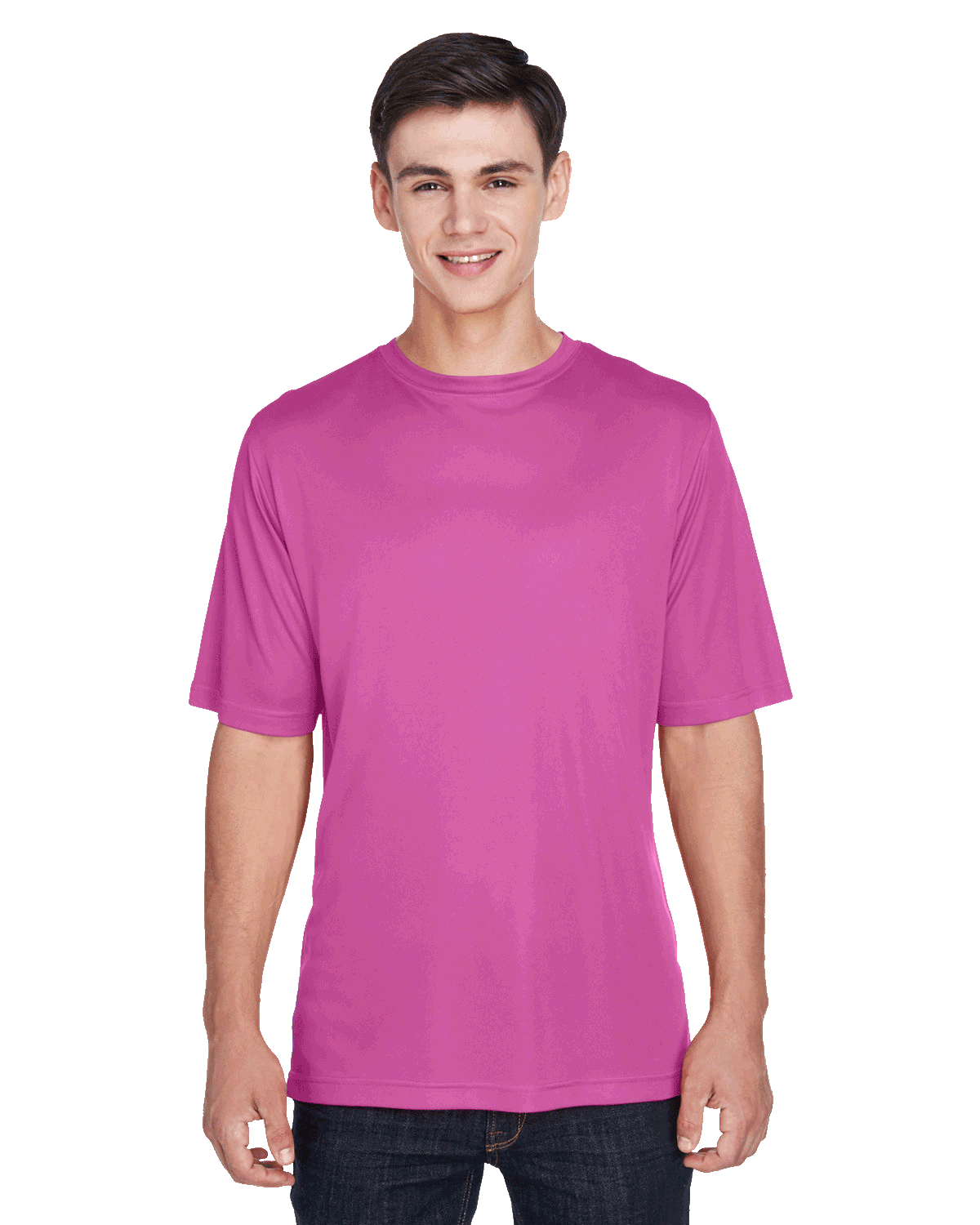 Boy wearing a Team 365 Men's Zone Performance T-Shirt in "Sport Charity Pink" color, standing with a relaxed posture and smiling.