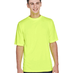 Boy in a "Safety Yellow" Team 365 Men's Zone Performance T-Shirt, standing with a relaxed posture and a cheerful expression.