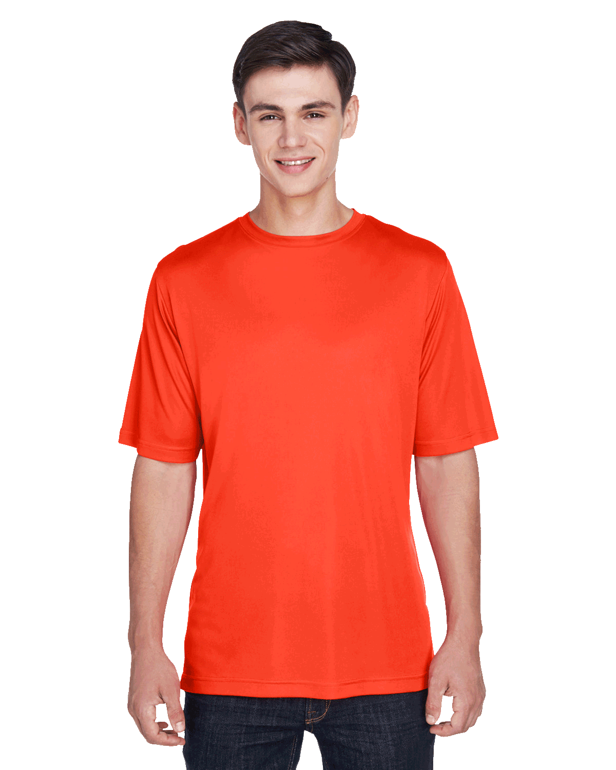 Boy in a "Sport Orange" Team 365 Men's Zone Performance T-Shirt, standing with a relaxed posture and a cheerful expression.