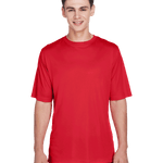 Boy wearing a Team 365 Men's Zone Performance T-Shirt in "Sport Red" color, standing with a relaxed posture and smiling.