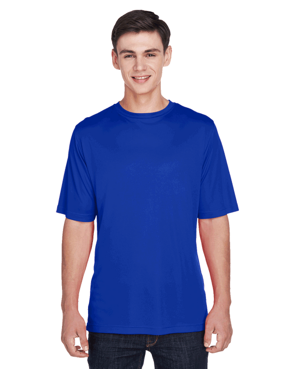 Teenager in a "Sport Royal" Team 365 Men's Zone Performance T-Shirt, standing with a relaxed posture and a cheerful expression.