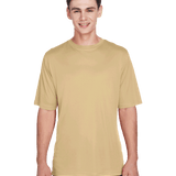 Boy in a "Sport Vegas Gold" Team 365 Men's Zone Performance T-Shirt, standing with a relaxed posture and a cheerful expression.