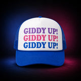White and royal Valucap VC700 trucker cap with three stacked GIDDY UP! lines in purple, pink, and royal blue