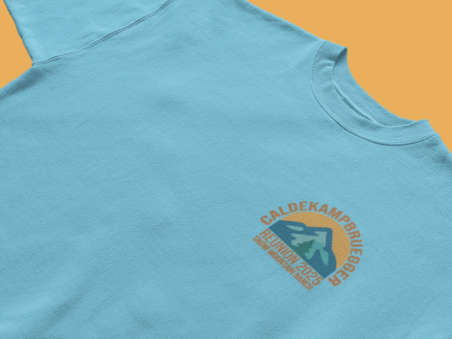 Light blue CALDEKAMP BRUEGER family reunion 2025 t-shirt with small arch logo and arrow-mountain graphic on left chest