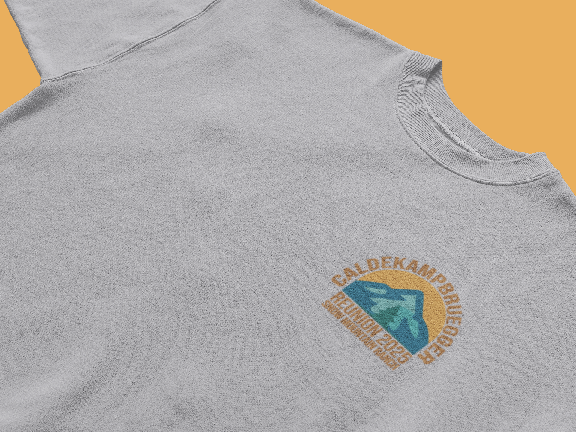 Light gray CALDEKAMP BRUEGER 2025 family reunion T-shirt featuring small arch logo with stylized mountain-arrow on left chest