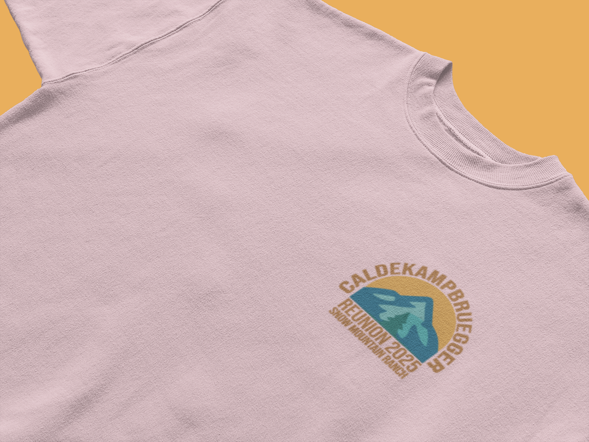 Light pink CALDEKAMP BRUEGER family reunion 2025 T-shirt with small left-chest arch logo and stylized mountain-arrow graphic